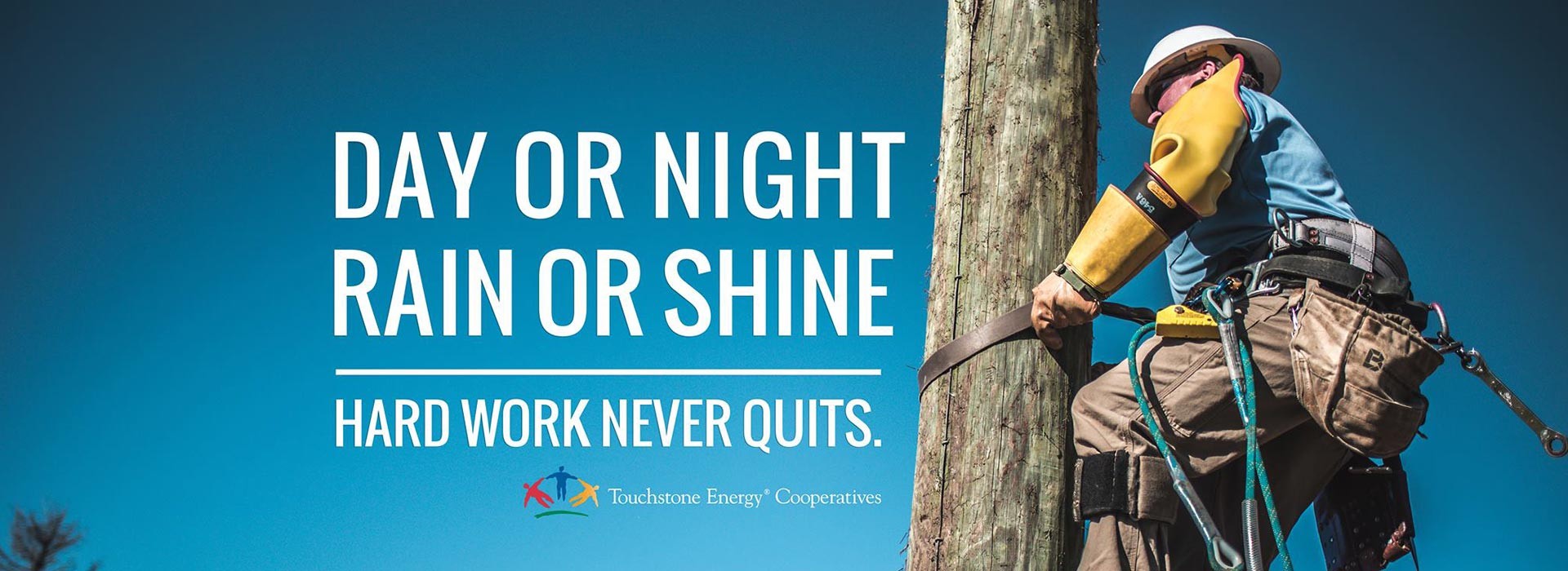 Day or night, rain or shine, hard work never quits. (Man working on power pole)