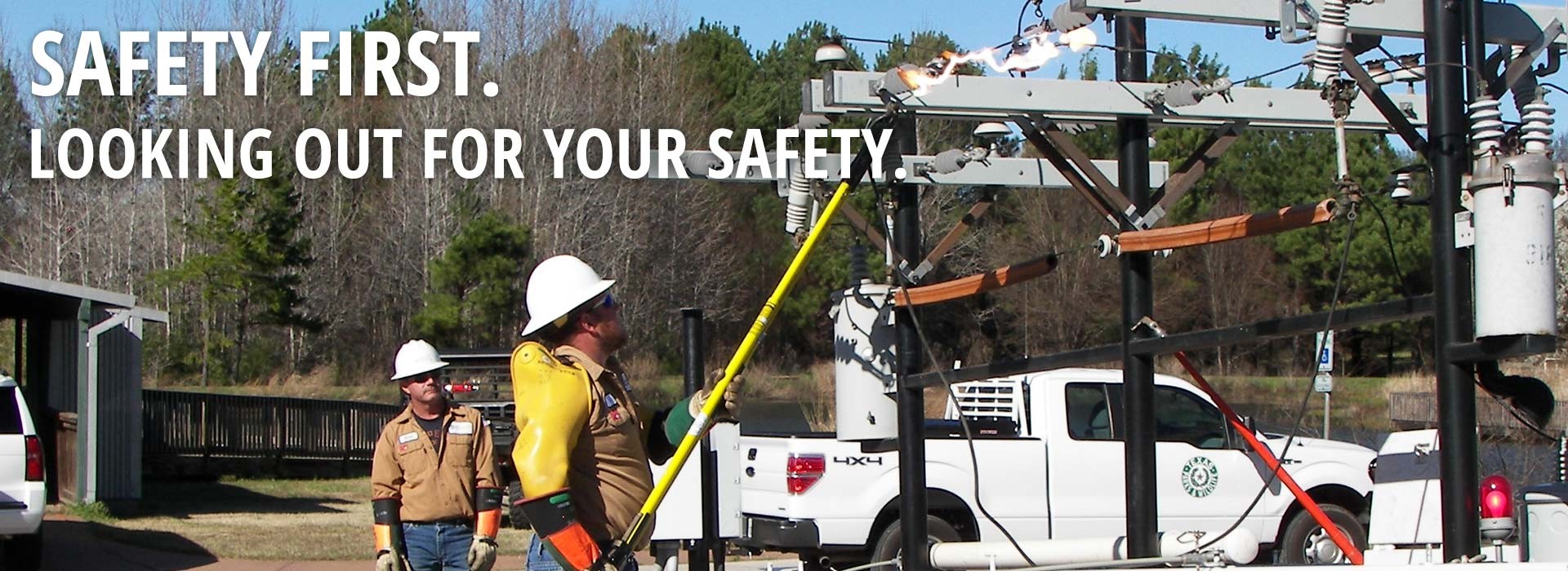 Safety First. Looking out for your safety. (Men training at power repair facility)